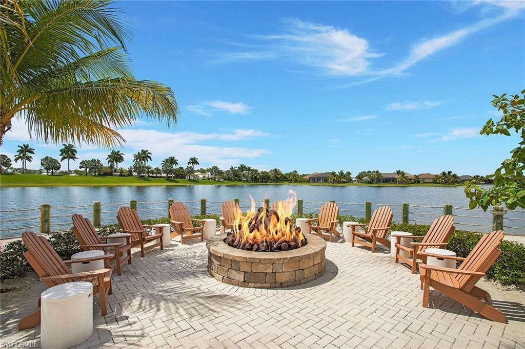 View of patio featuring a water view and an outdoor fire pit