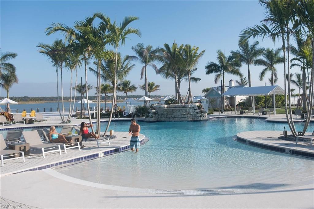 View of pool with a water view