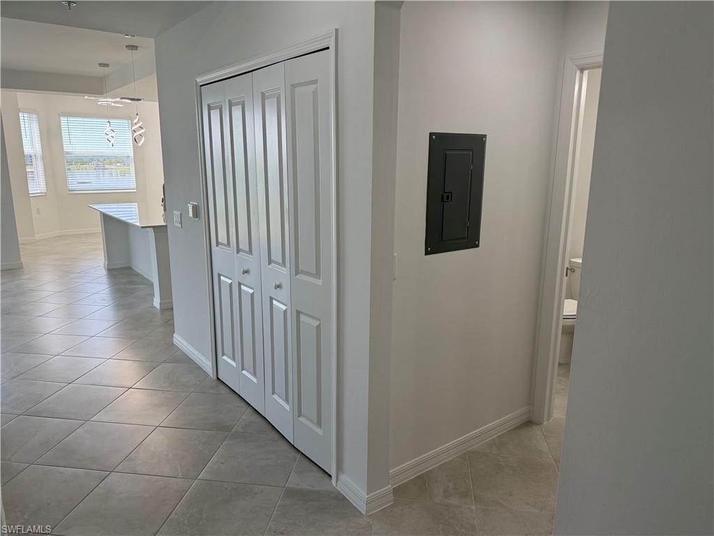 Hallway to living room, dining area, and kitchen