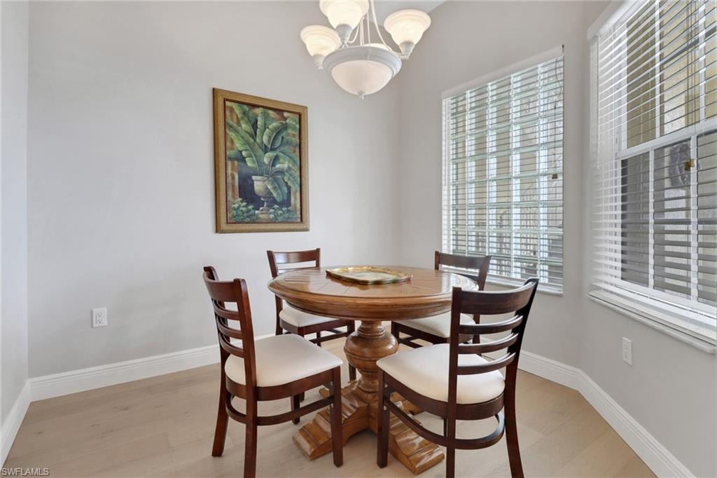 Dining area with a chandelier and light wood finished floors