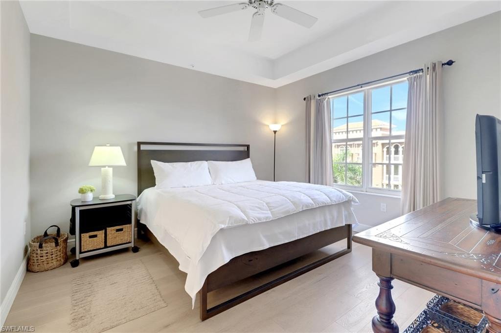Bedroom with wood finished floors and a ceiling fan