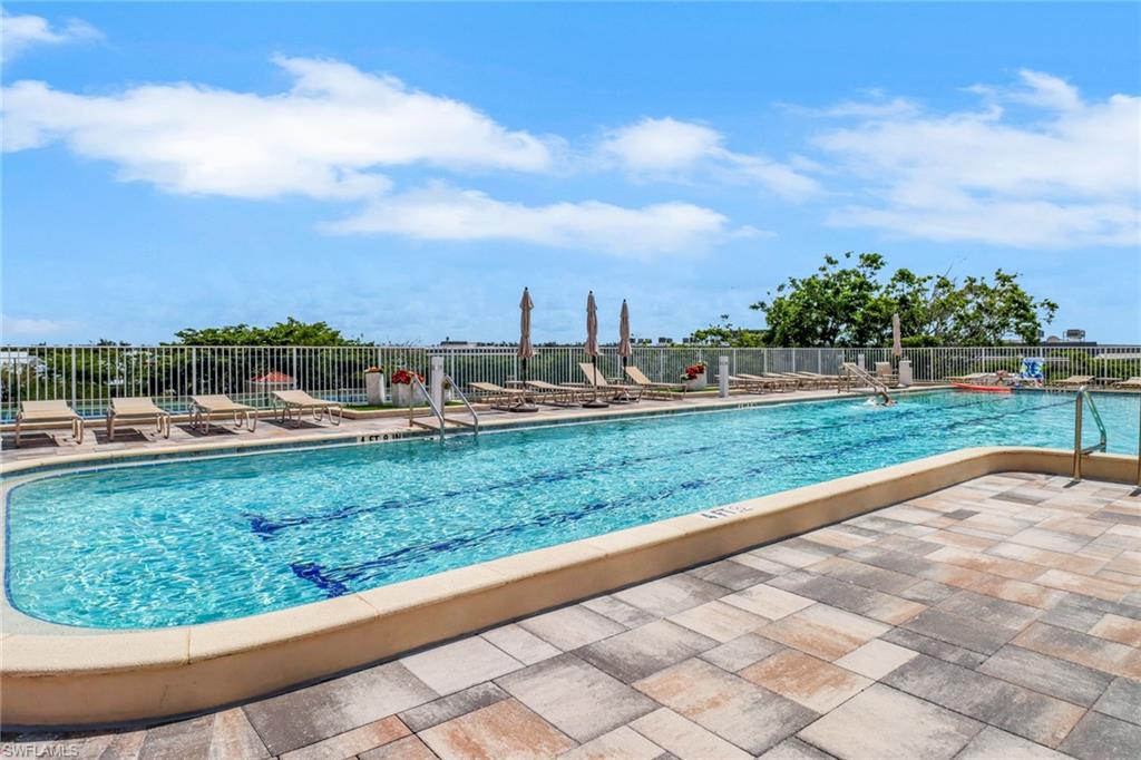 Community pool with a patio