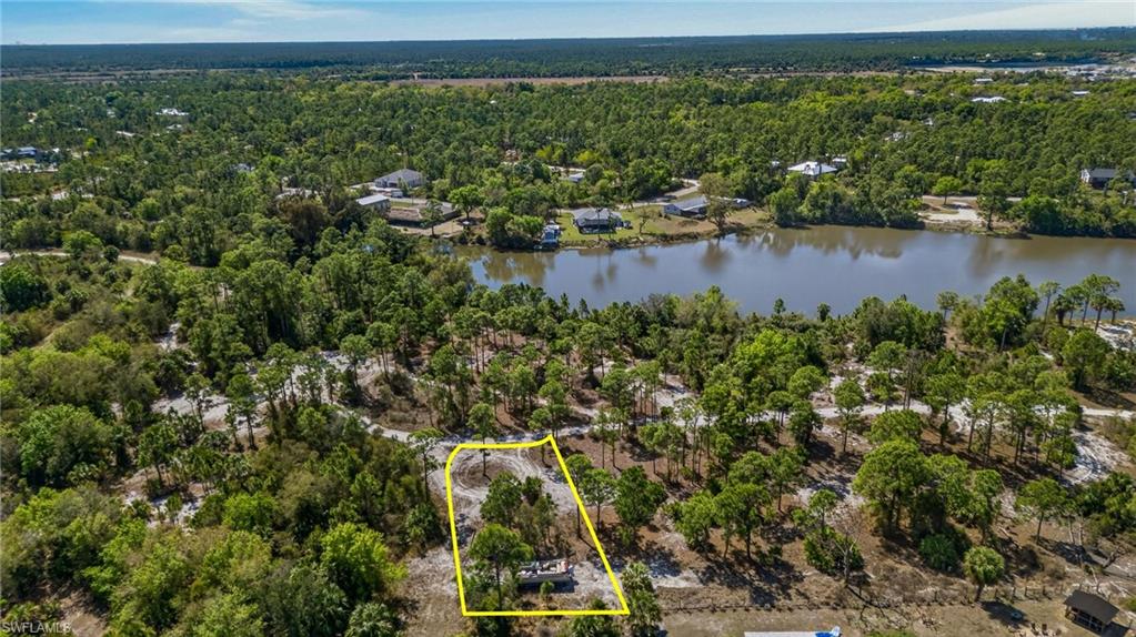 View of property location with property boundaries highlighted and a large body of water