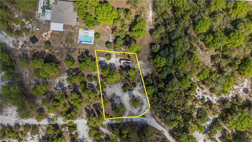 Aerial overview of property's location featuring property parcel outlined
