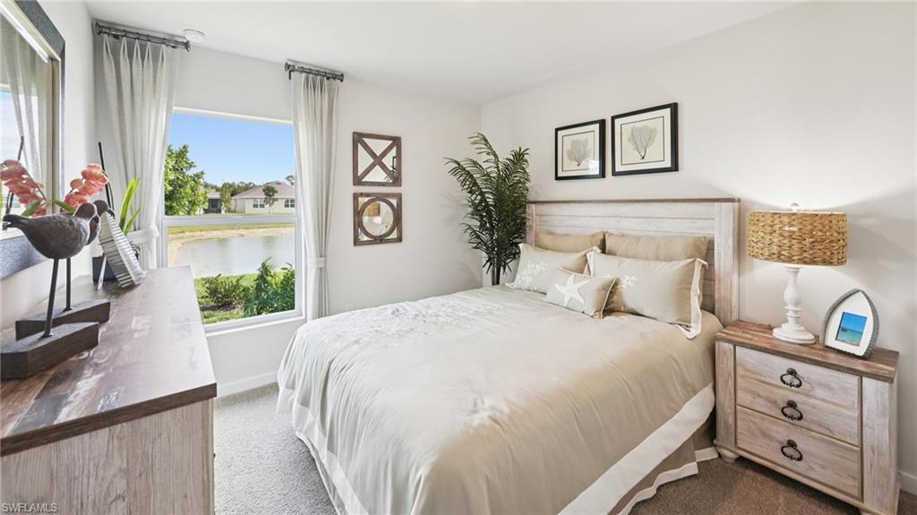 Model Home. This room features a window providing views of a body of water and surrounding properties