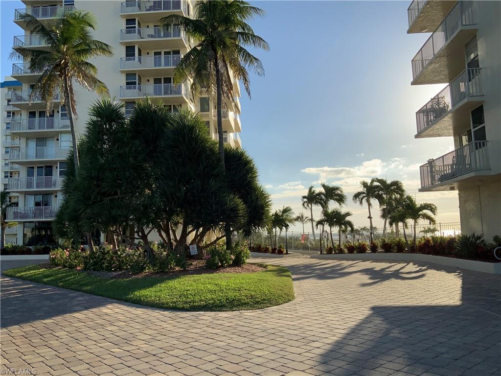 Palm trees and beautiful blooming landscape thru out !