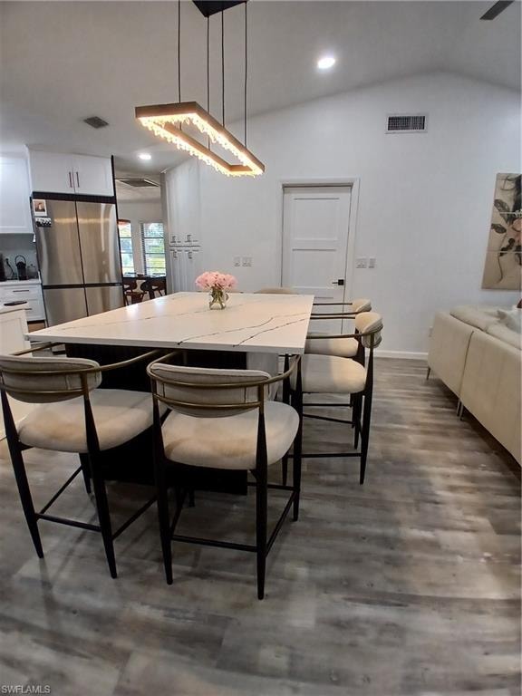 Spacious kitchen island featuring a light-toned countertop with dark veining
