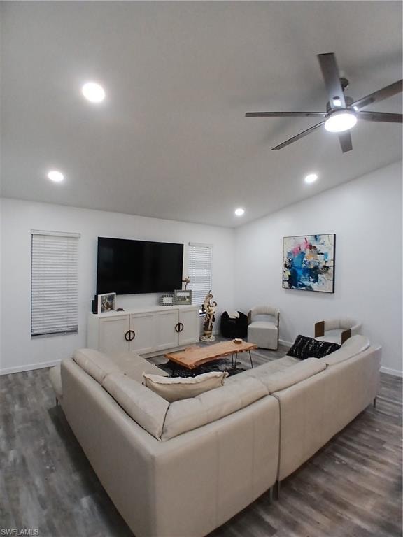 Living space featuring recessed lighting, a modern ceiling fan, and wood-finish flooring