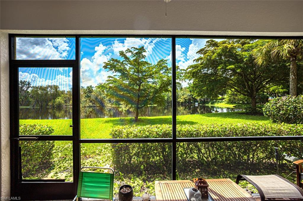 Screened enclosure overlooking a tranquil pond