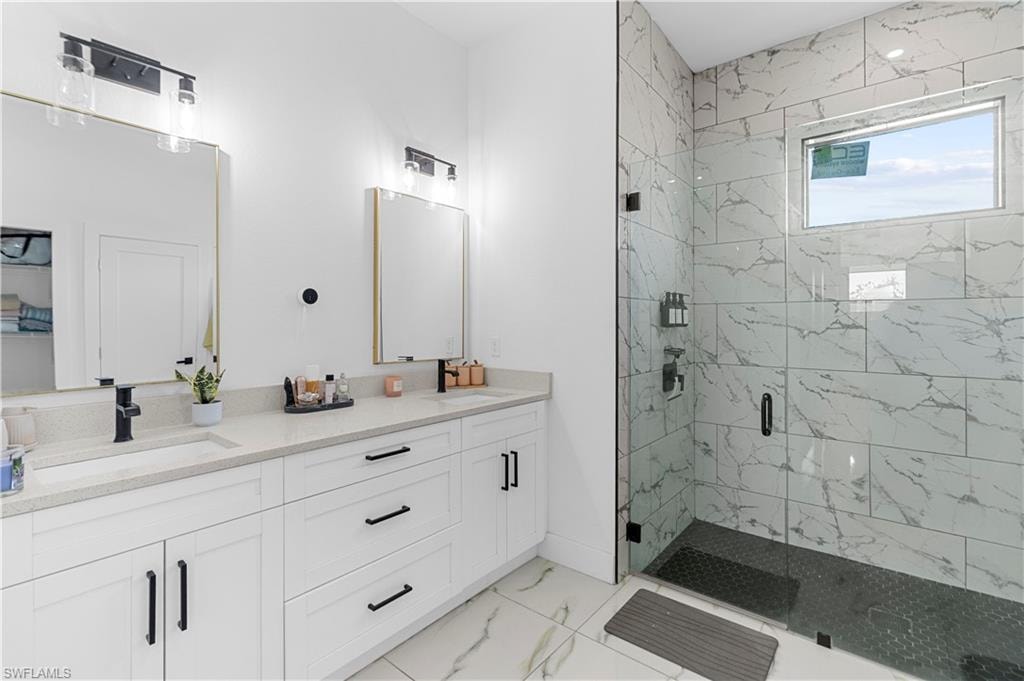Dual vanity with light-toned countertops and white cabinetry, complemented by matte black fixtures