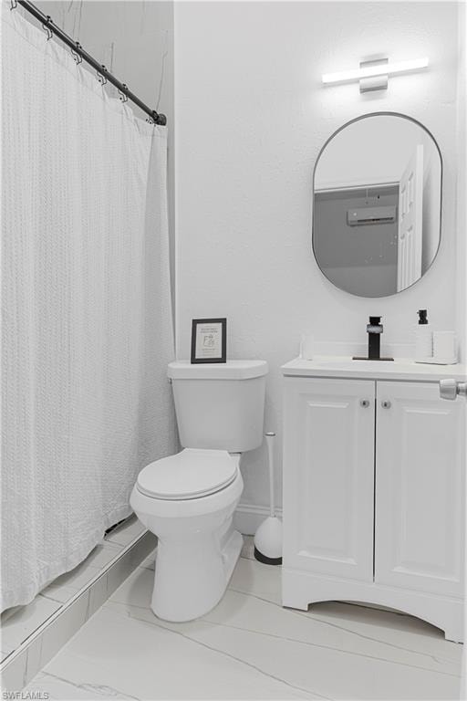 Modern bathroom featuring a white vanity with panel-style doors, a rectangular undermount sink, and a matte black faucet