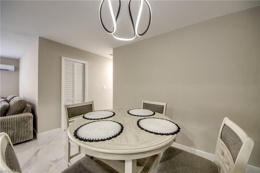 Contemporary lighting fixture over a round dining table