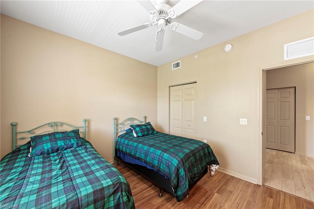 Interior room featuring wood-finish flooring and neutral wall tones