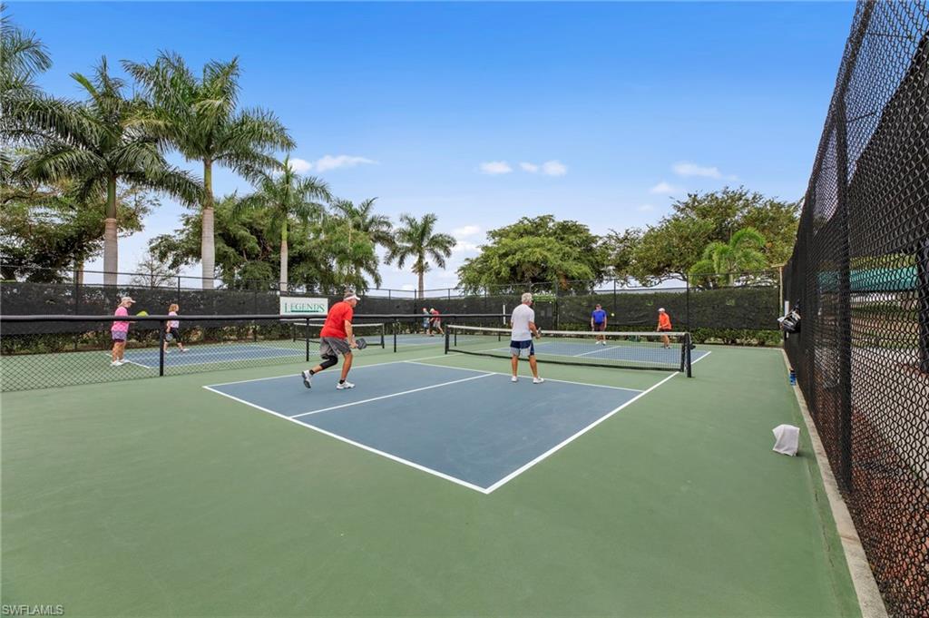 Dedicated pickleball courts featuring a green and blue surface, white boundary lines, and black net systems
