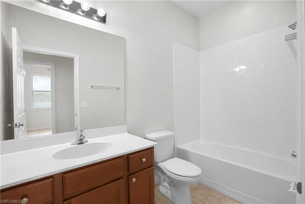Bathroom featuring a single-sink vanity with wood cabinetry and a white countertop