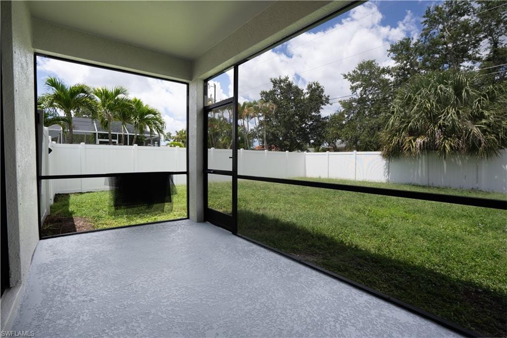 Screened lanai with a textured concrete floor