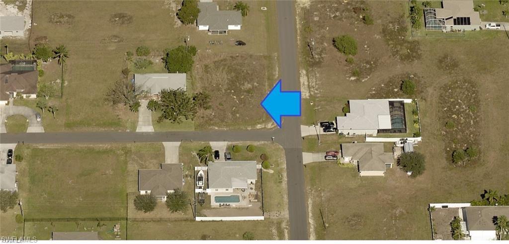 Cleared lot with street frontage, surrounded by residential properties