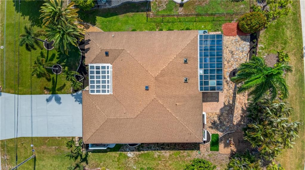 Aerial perspective highlighting a hip roofline with two skylights