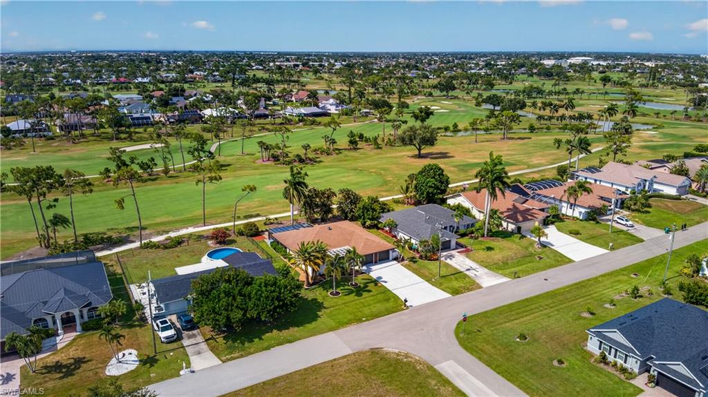Expansive aerial panorama showcasing a residential street with diverse home styles