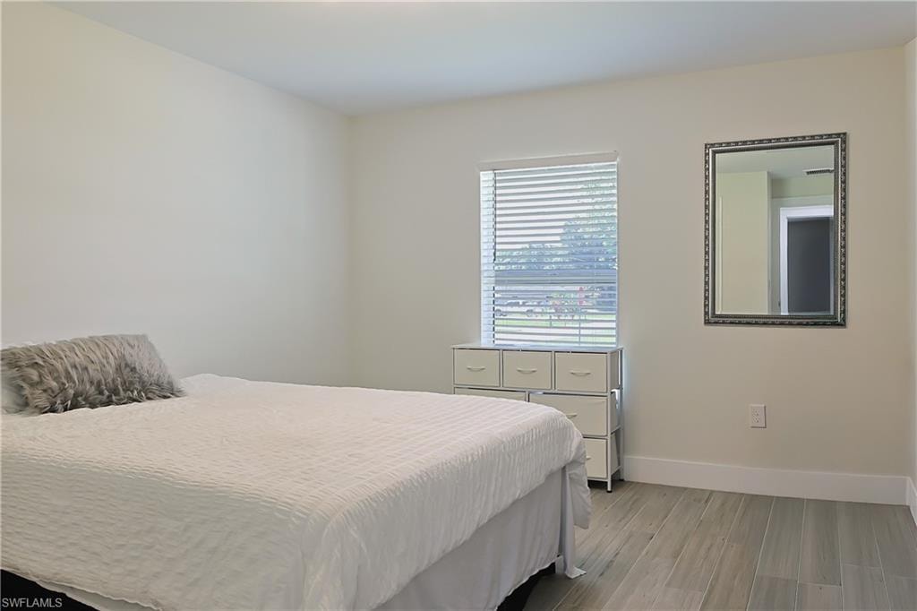 Neutral wall paint complementing wood-finish flooring