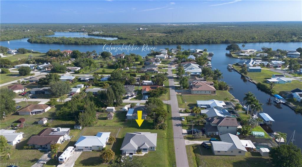 Aerial perspective showcasing the residential area with the Caloosahatchee River in the background