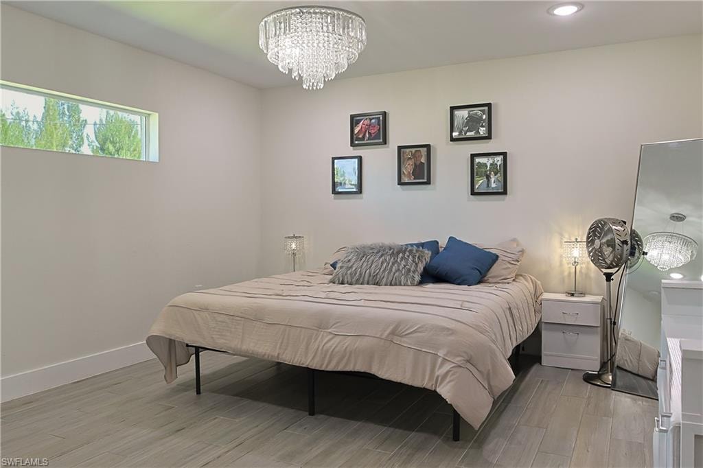 Recessed lighting complements a statement crystal chandelier