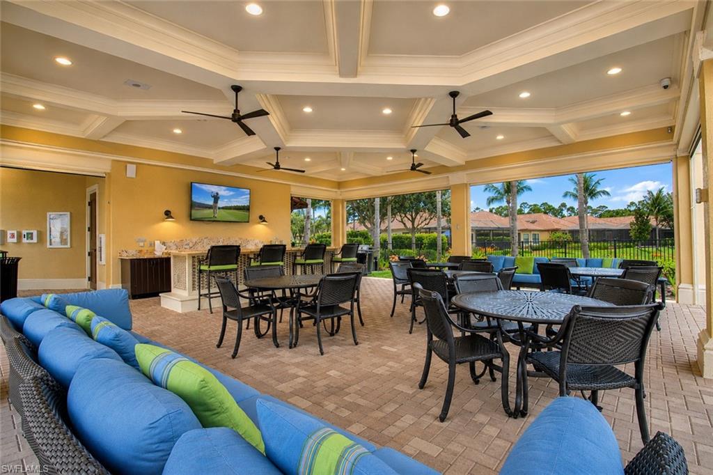 Bonita Isle's covered outdoor lounge space featuring a coffered ceiling with recessed lighting and ceiling fans