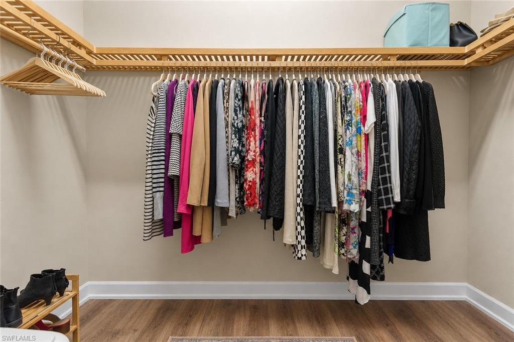 Primary bedroom features two walk-in closets
