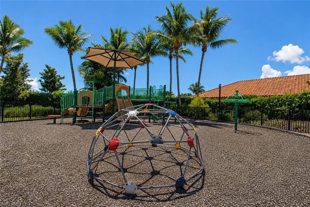 Bonita Isles playground area featuring a geometric climbing dome, multi-level play structure with slides
