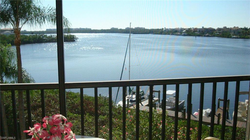 Screened lanai overlooking expansive waterfront