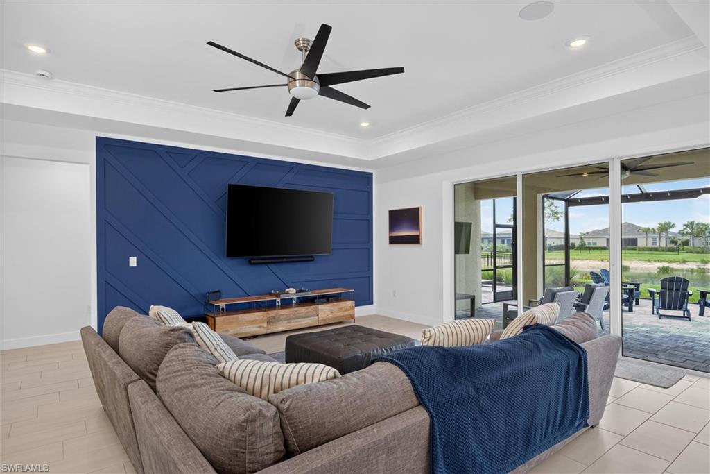 Great room, overlooking the oversize patio and a designer wall