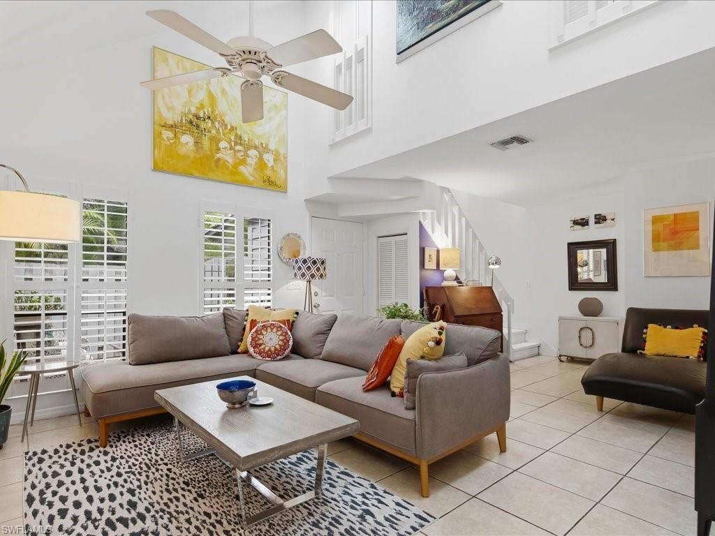 Vaulted ceiling with a ceiling fan and recessed lighting