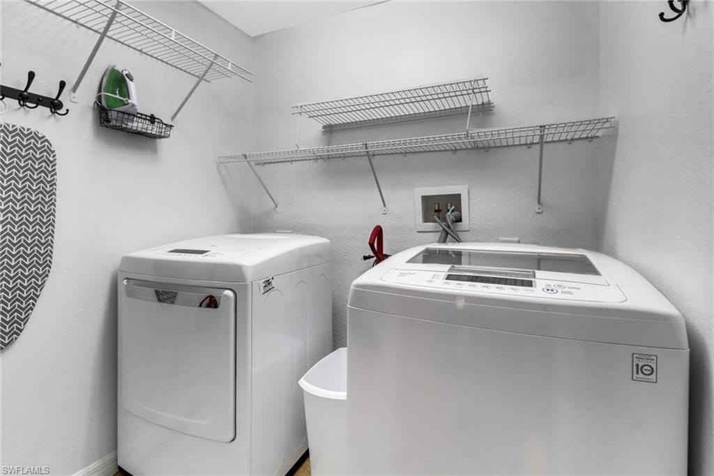 Laundry room featuring washing machine and clothes dryer