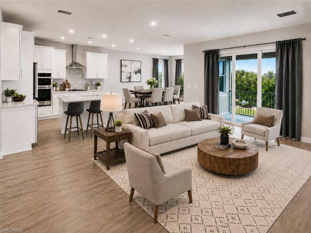 Photo includes reality staging to showcase the possibility of the kitchen/living/dining room. Design services included with purchase!