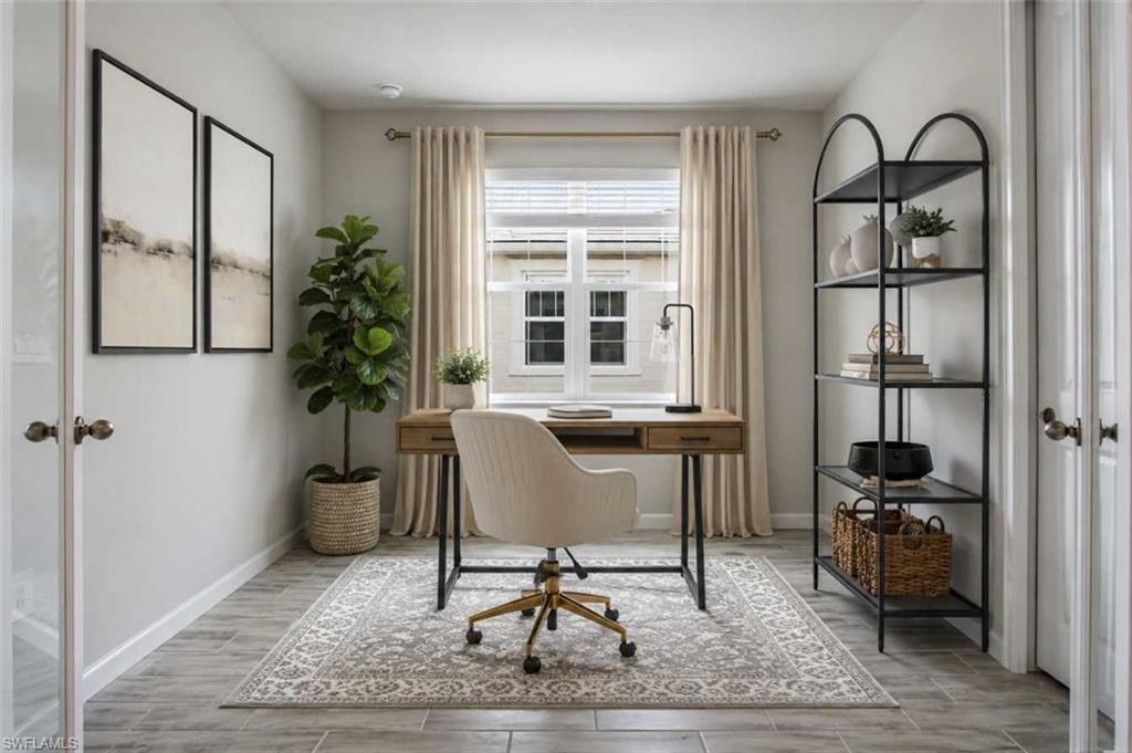 Photo includes reality staging to showcase the possibility of the den/office/guest bedroom. Design services included with purchase!