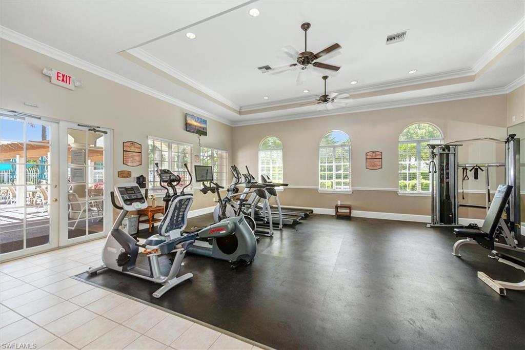 Clubhouse II - Fitness center featuring varied exercise equipment, arched windows, ceiling fans, recessed lighting, and direct access to an outdoor area