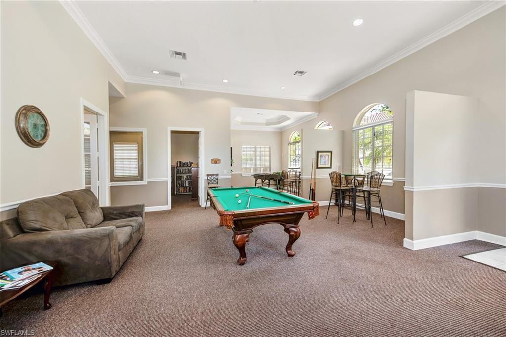 Recreational room featuring a billiard table, arched windows, recessed lighting, and crown molding