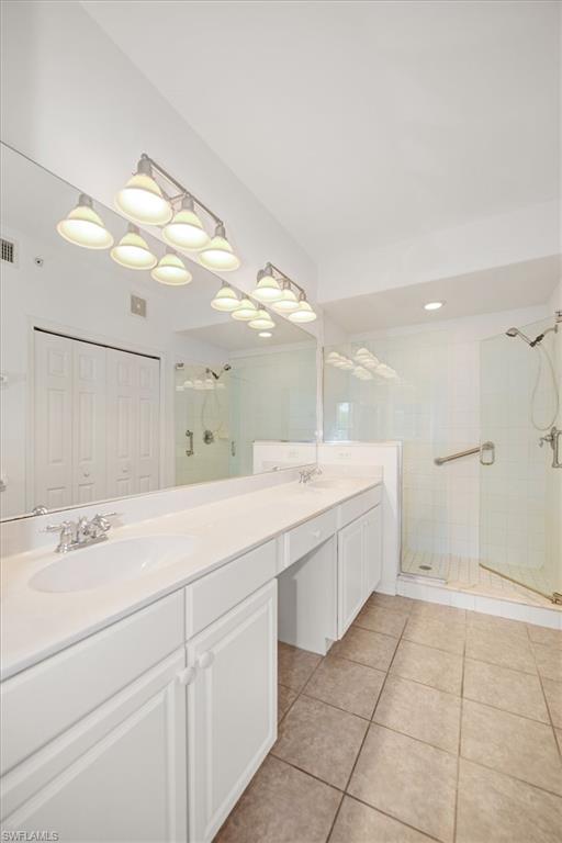 Dual vanity with integrated sinks, expansive counter space, and lower cabinetry