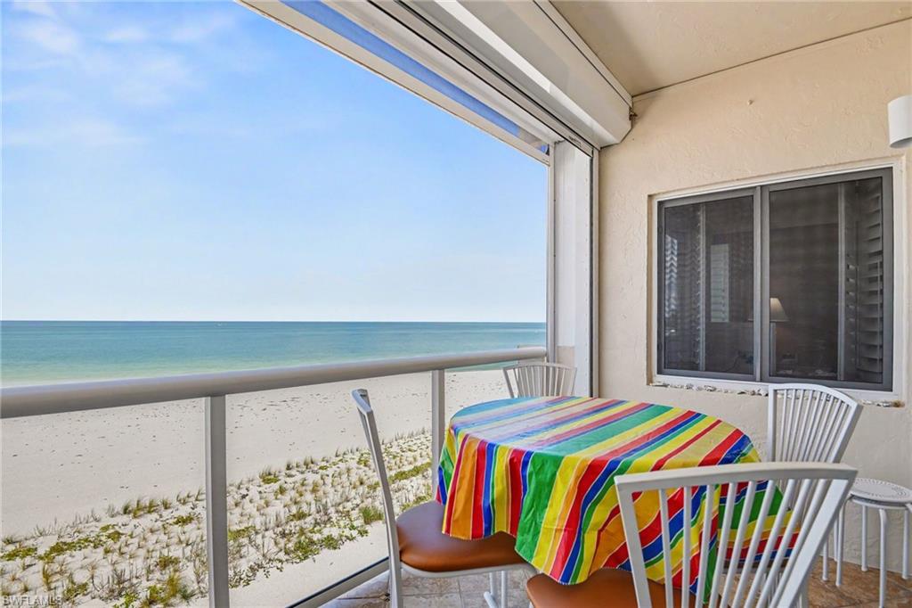 DIRECT GULF VIEW FROM THE TILED LANAI.  REMOTE CONTROLLED PICTURE WINDOW NO-SEEUM SCREEN PLUS NEW ELECTRIC METAL SHUTTER.  IMPACT RESISTANT OWNER'S SUITE WINDOW SHOWN.  ENTRANCE TO LIVING AREA IS TO RIGHT.