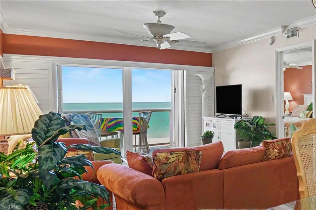 GULF VIEW IS AMAZING.  ENJOY THE OPEN AIR LANAI OR LOWER THE REMOTE CONTROLLED NO-SEEUM PICTURE WINDOW SCREEN.  LANAI ALSO HAS NEW ELECTRIC METAL SHUTTER.  SLIDING DOOR ALSO HAS A CONVENIENT SCREEN.  ENTRANCE TO PRIMARY SUITE IS SHOWN AT RIGHT.  PLANTATION SHUTTERS FOR LANAI IMPACT SLIDING DOOR.