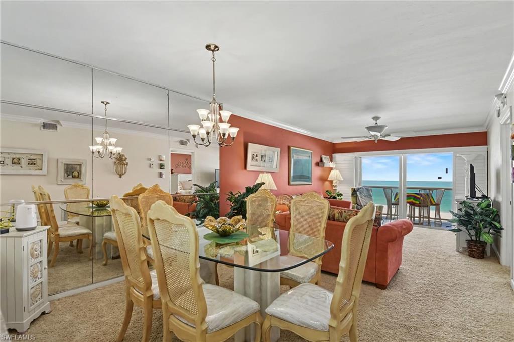 DINING AREA IS HIGHLIGHTED BY THE SPARKLING GULF VIEW.