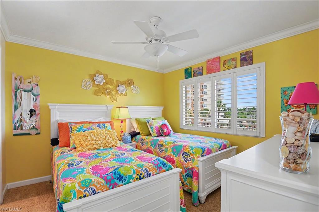 COLORFUL GUEST BEDROOM SUITE W/EN-SUITE BATH AND WALK-IN CLOSET.  CROWN MOLDING.  IMPACT RESISTANT WINDOW W/PLANTATION SHUTTERS.