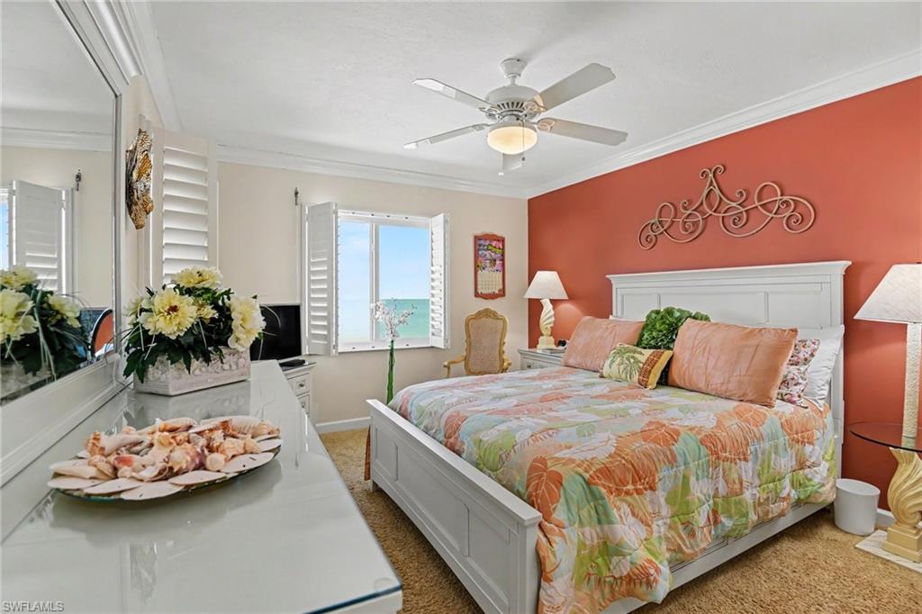 PRIMARY SUITE.  SOUTH AND WEST IMPACT WINDOWS WITH PLANTATION SHUTTERS.  CROWN MOLDING.