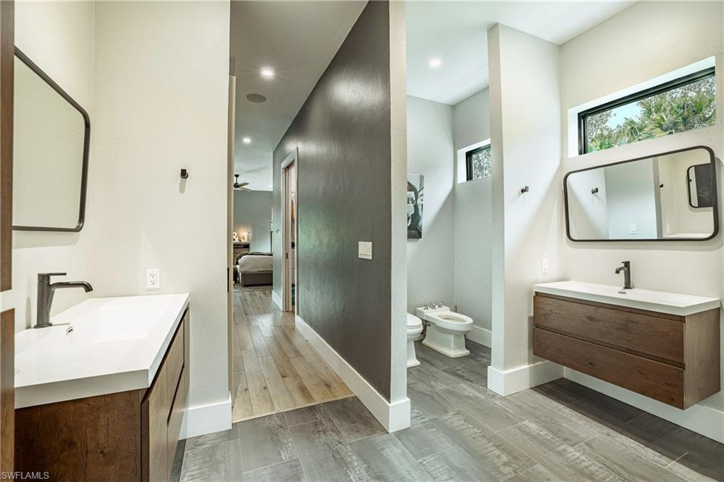 Hallway featuring wood-finish flooring and recessed lighting