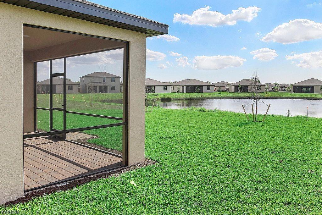 Screened lanai featuring wood-finish flooring and a stucco exterior
