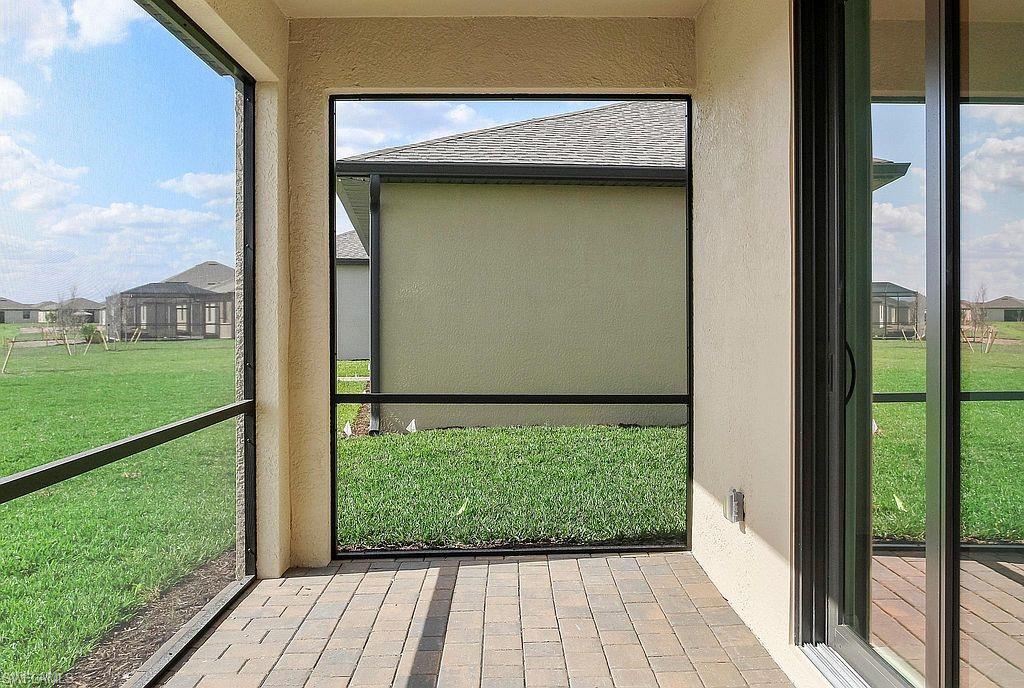 Screened patio featuring paver flooring and direct access to the interior via sliding glass doors