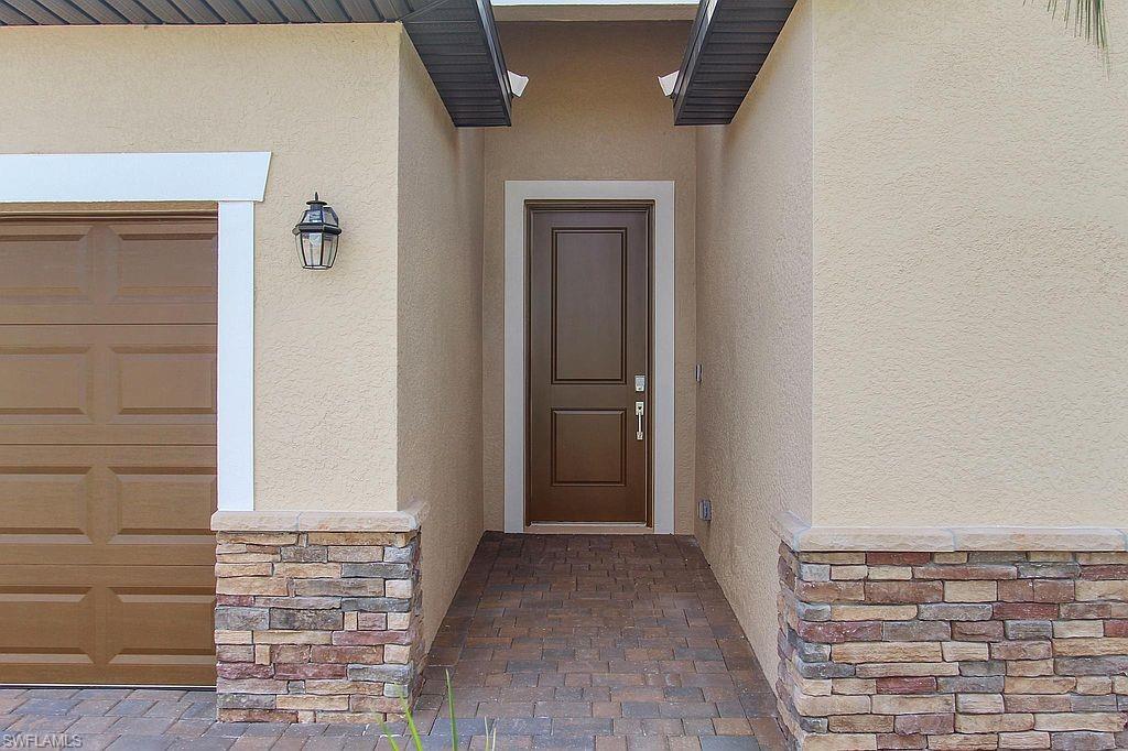 Stucco exterior with stacked stone accents