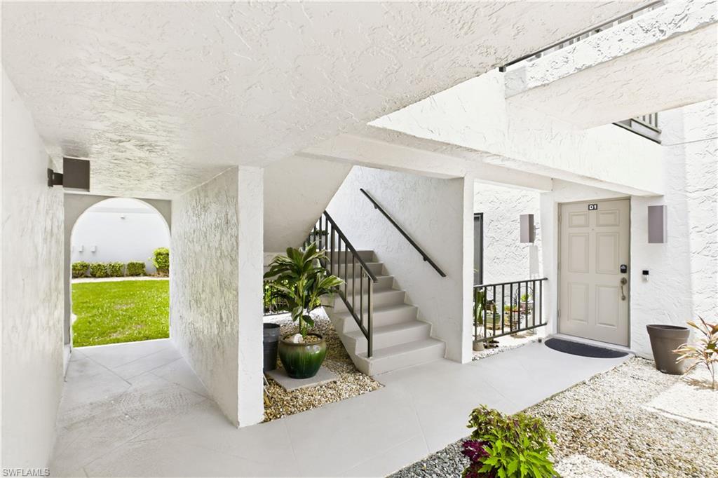 Covered stairway leading to the second-floor condo entrance