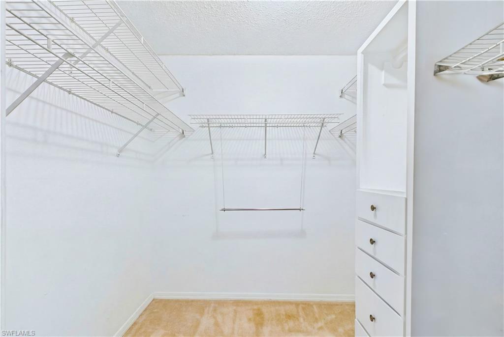 The SPACIOUS PRIMARY SUITE features a WALK-IN CLOSET