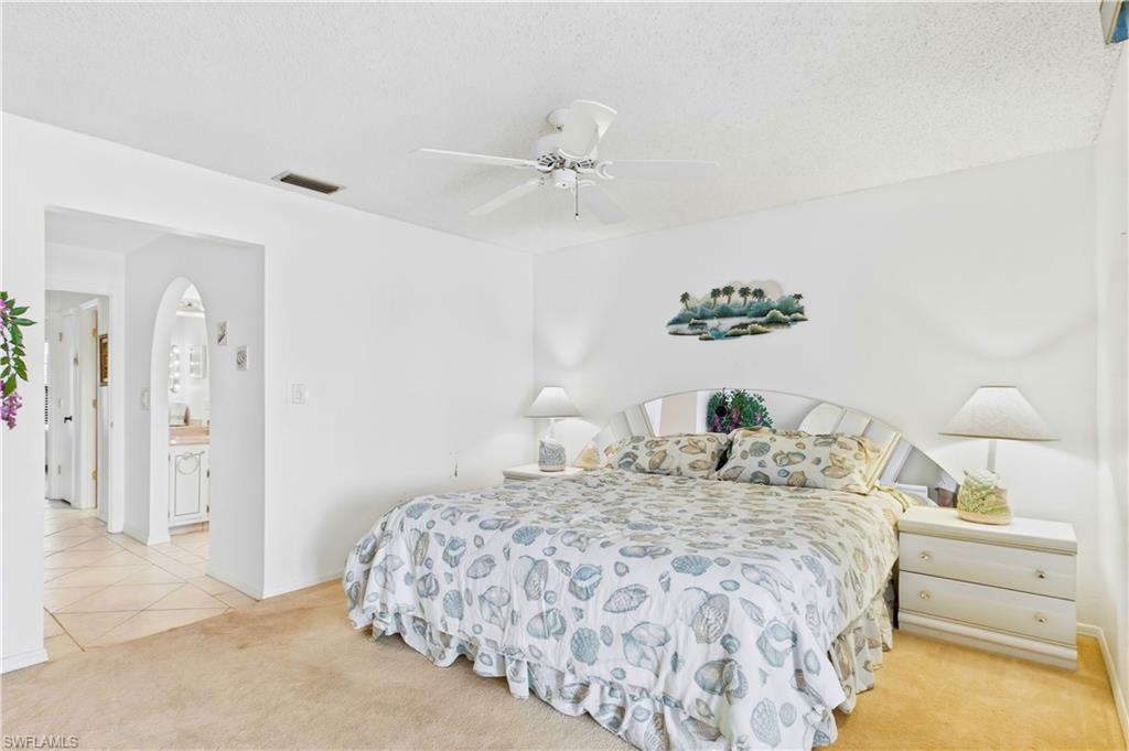 Spacious primary bedroom with room to unwind and a peaceful, airy feel.